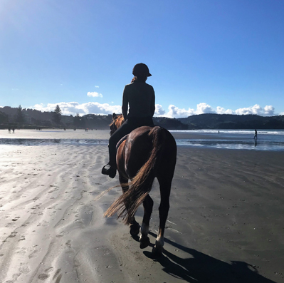 Nicqui Nicqui Redman riding horse on Orewa Beach Auckland NZ